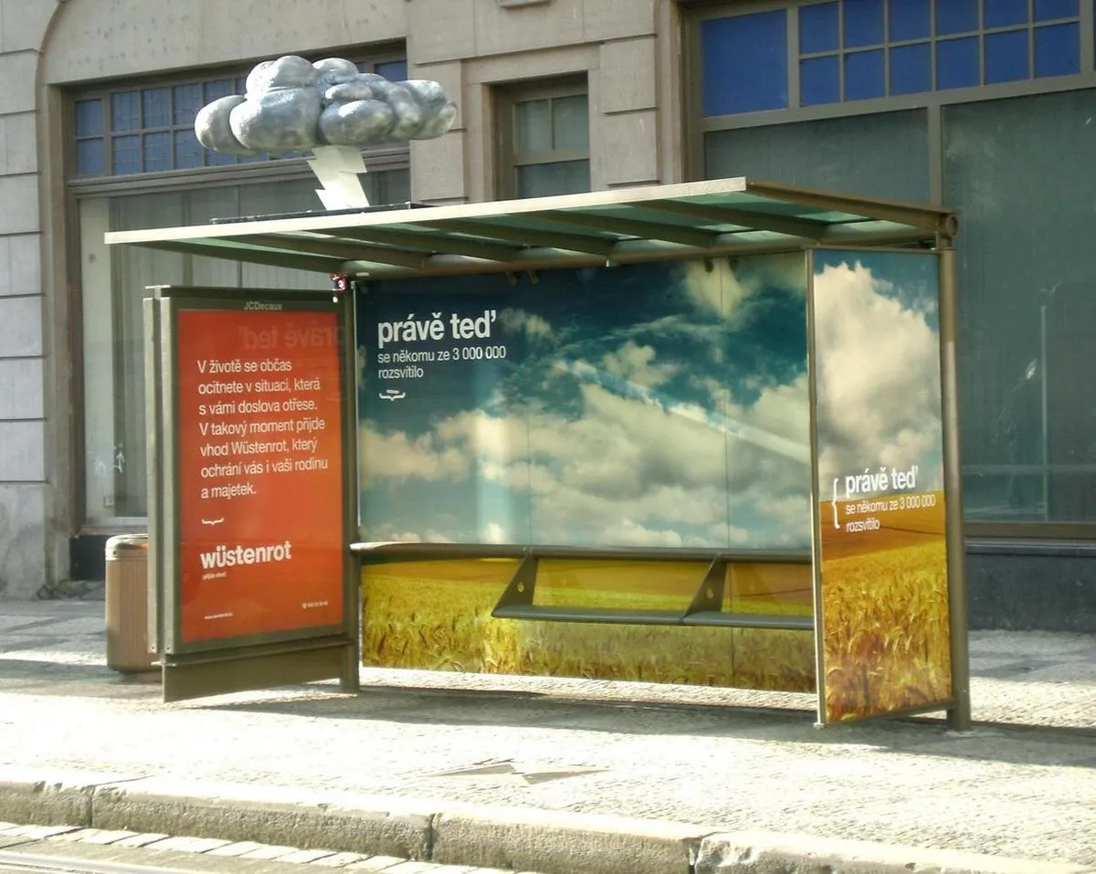 A digital signage enclosure unit at a bus stop.
