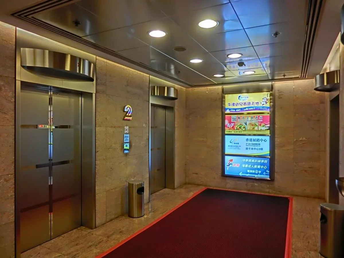 A Raspberry Pi digital signage player in a black case.