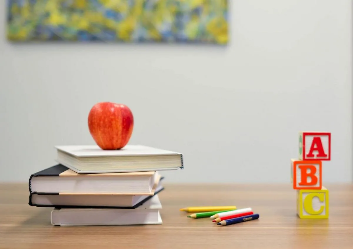 Books and pencils on a desk at a school for the blind.