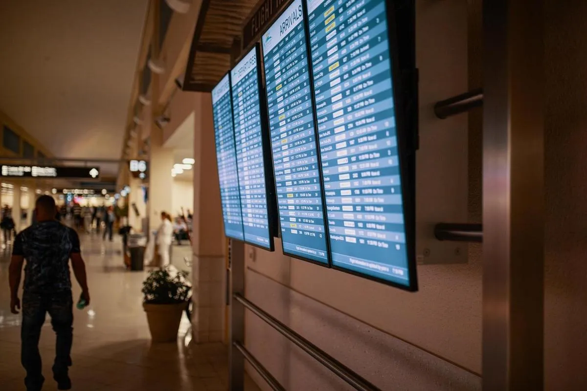 Smart signage displays on a wall for transportation times.