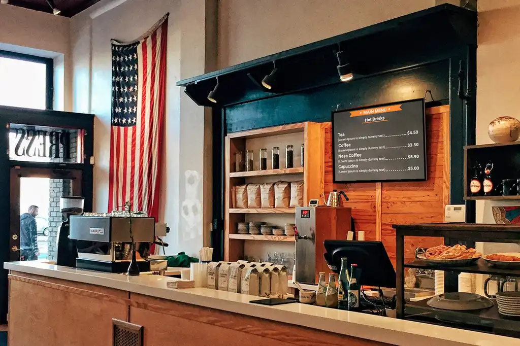 A coffee shop digital sign on display.