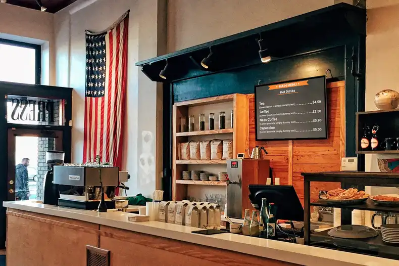 A coffee shop digital sign on display.