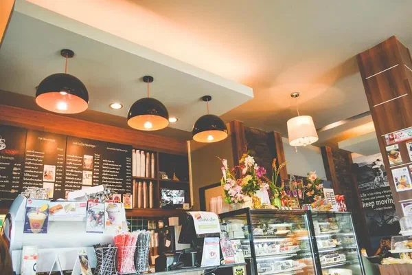 This image shows a typical cafe restaurant that could greatly benefit from a transition to digital menu boards.