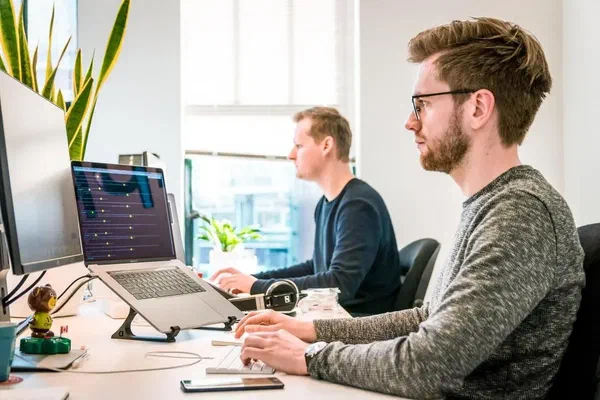 An image of a developer switching from open source digital signage to the paid version of Screenly.