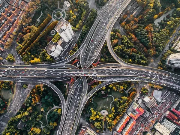 A busy highway intersection packed with traffic and cars.