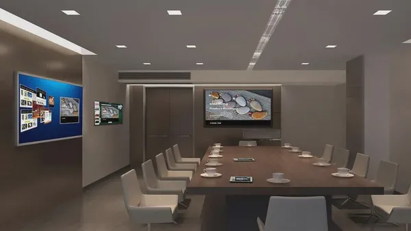Digital signs on a conference room wall controlled by digital signage content management software.