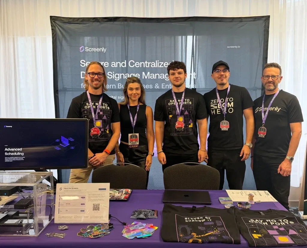Team Screenly at the 44CON 2026 booth with the Hack the Screens Capture the Flag setup