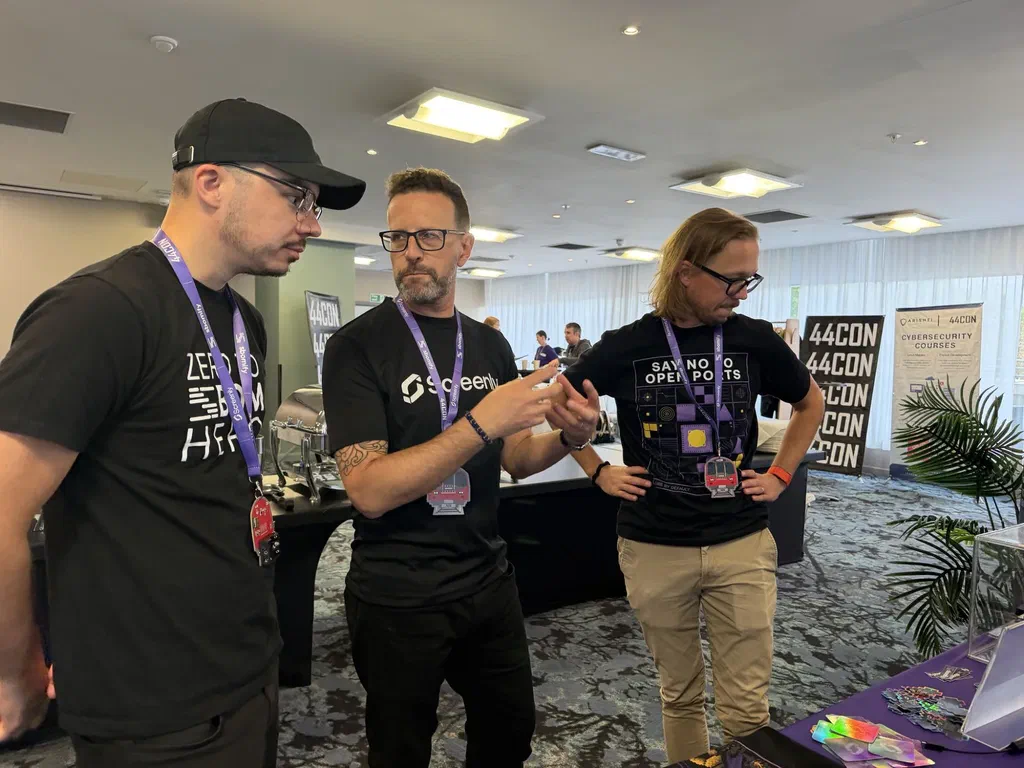 Screenly team members talking at 44CON 2026