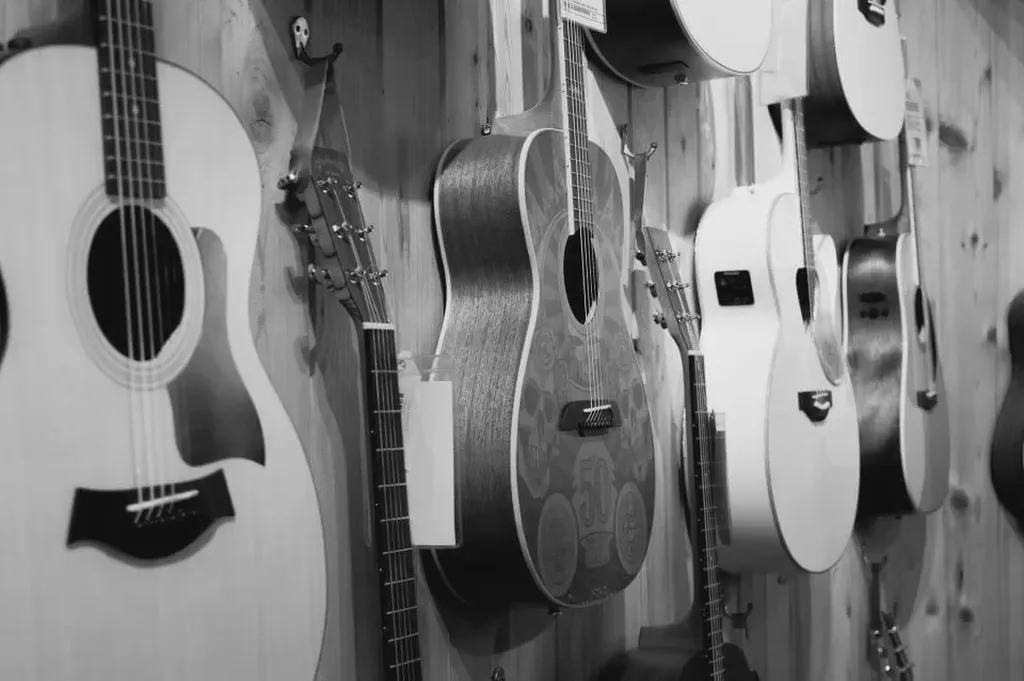This is an image from StockSnap of guitars on a wall that is great for use with digital signage networks.