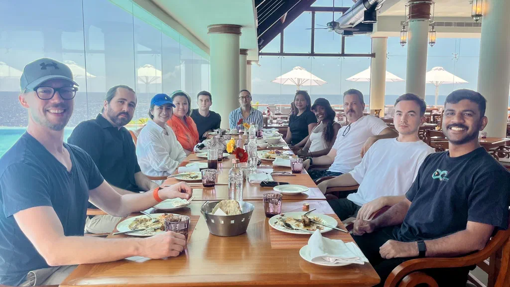 The Screenly team sharing lunch at The Terrace overlooking the sea