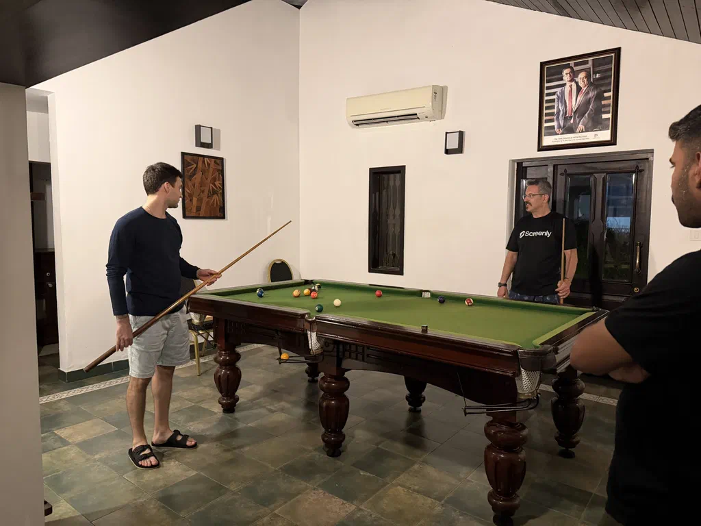 Pavel and Murat playing a game of billiards