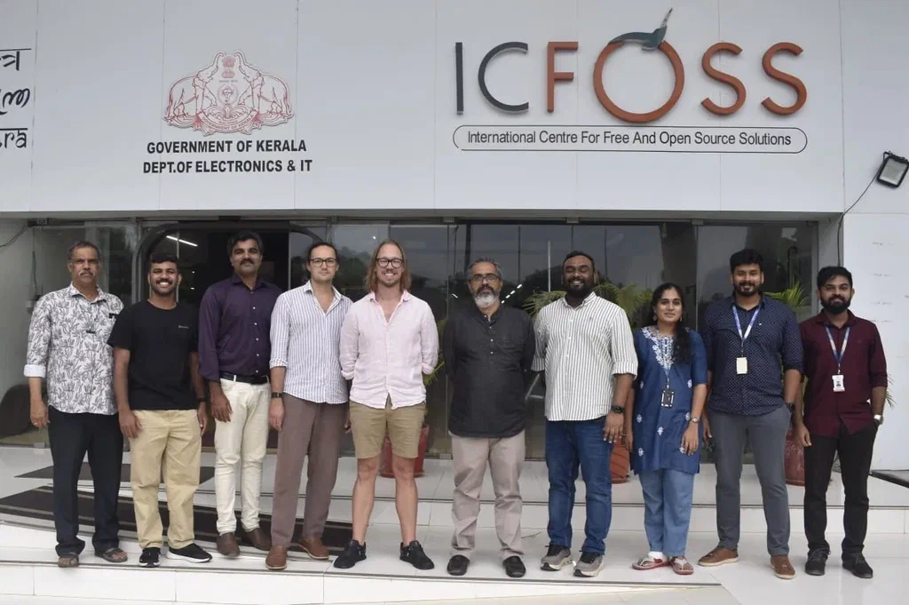 Salman, Viktor and Renat with the ICFOSS team outside the ICFOSS building