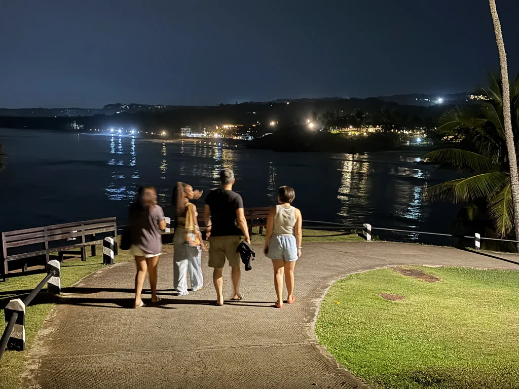 Screenly team members walking along the waterfront at night