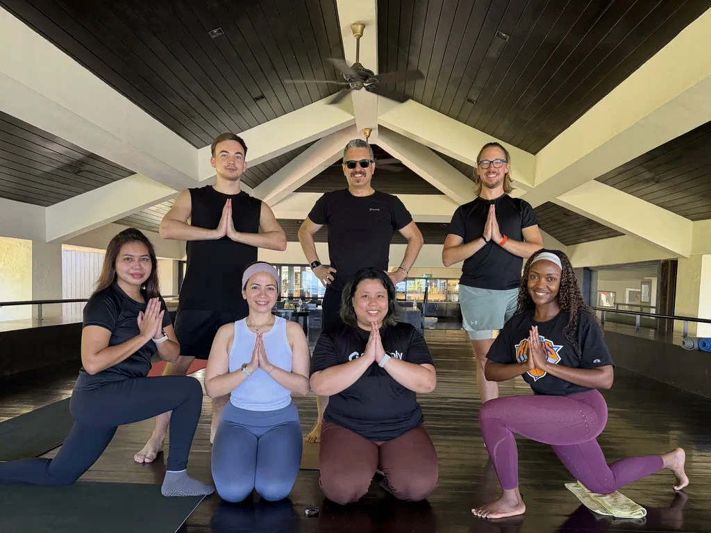The Screenly team posing together after a yoga session