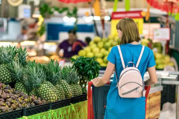 An image of a woman shopping in a supermarket.