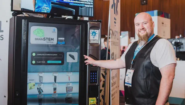 This image is of a vending machine that integrates with the Screenly digital signage APIs to provide a digital signage add on.