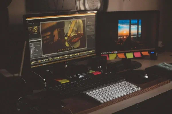 This image is of two computers displaying video creation software that you can use to create video content for your digital signage video walls.